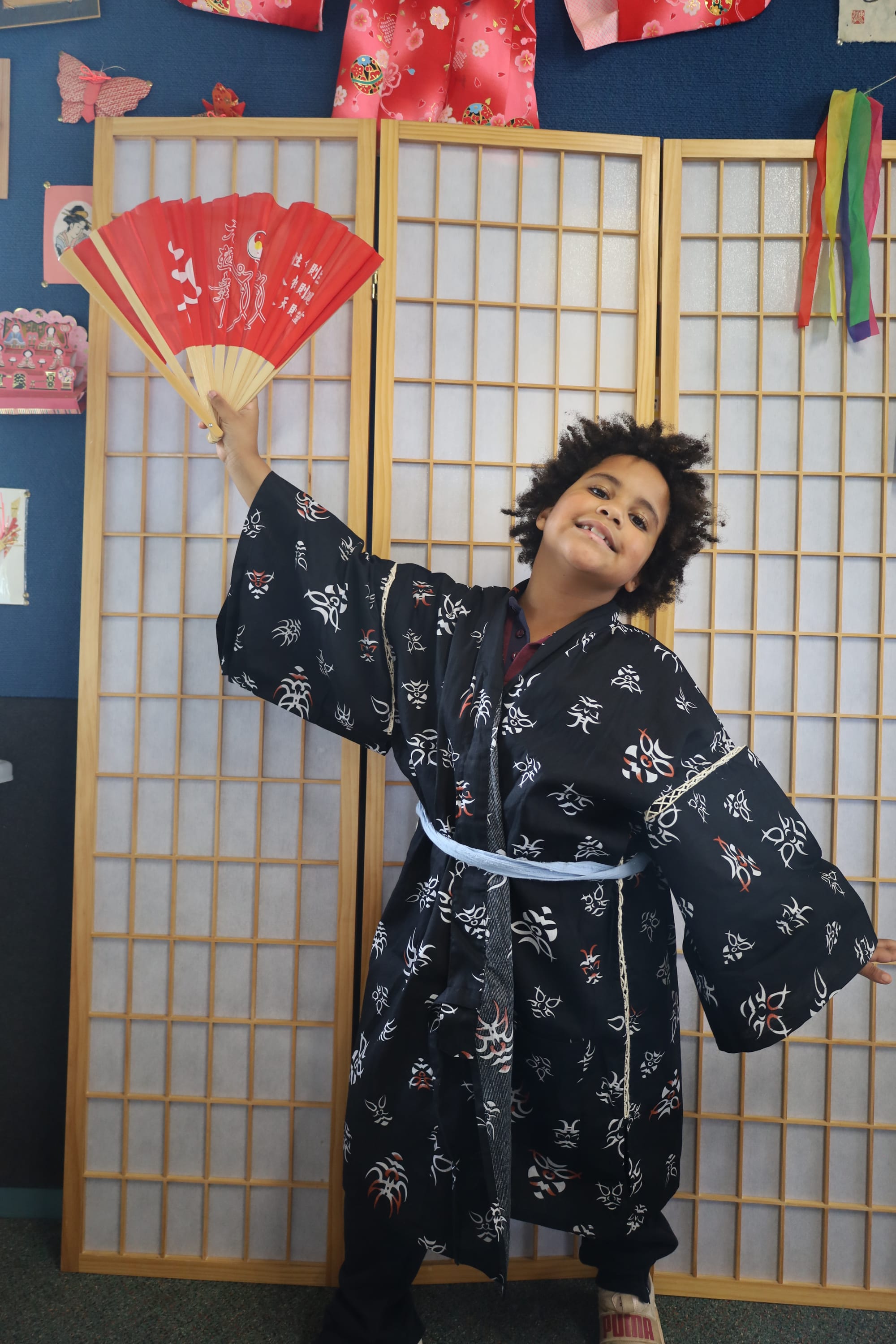 Enjoying trying on a kimono is Aurora Stewart.