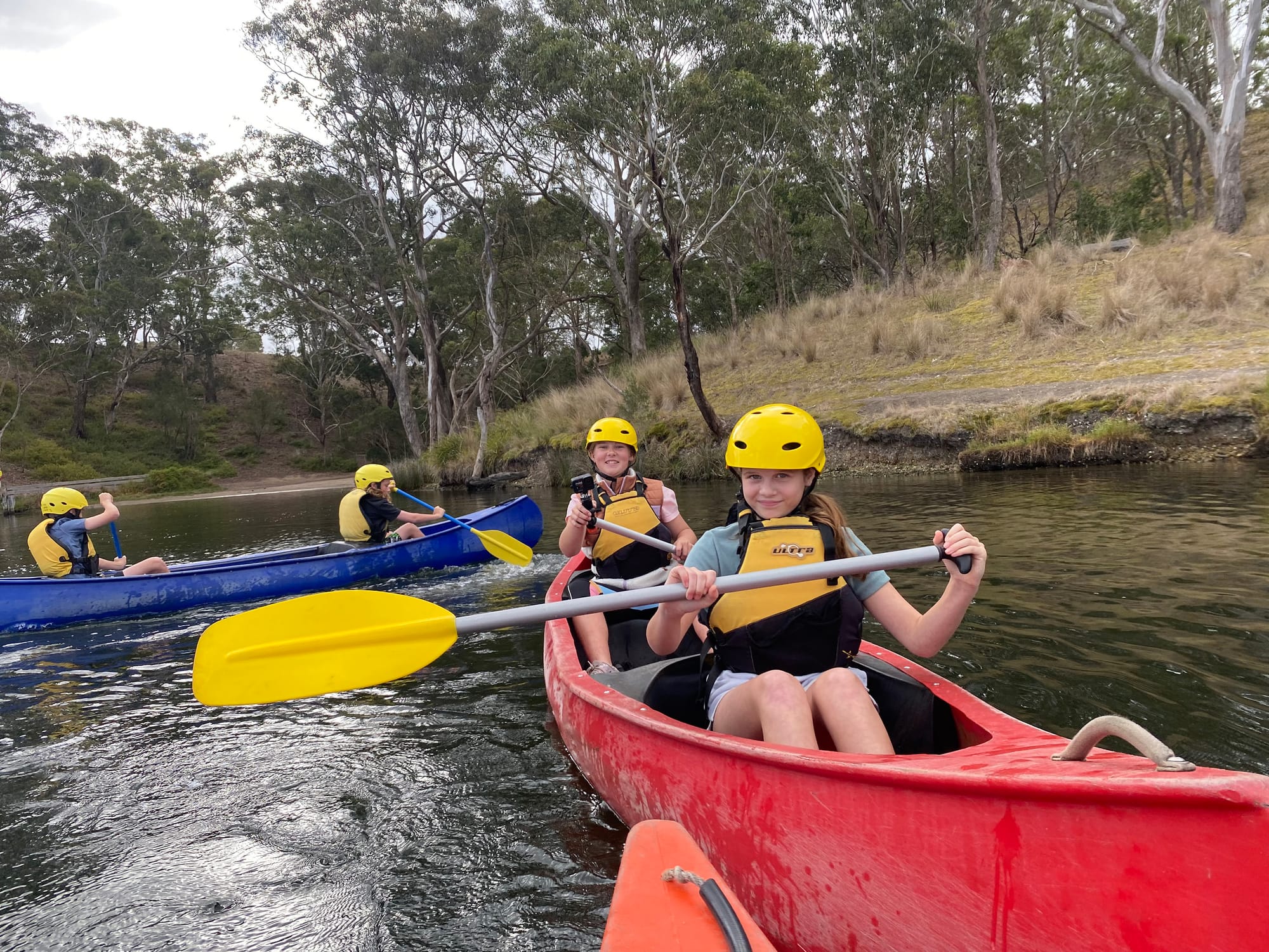 Staying dry in their canoe are Siena Rikken and Lola Rowe.
