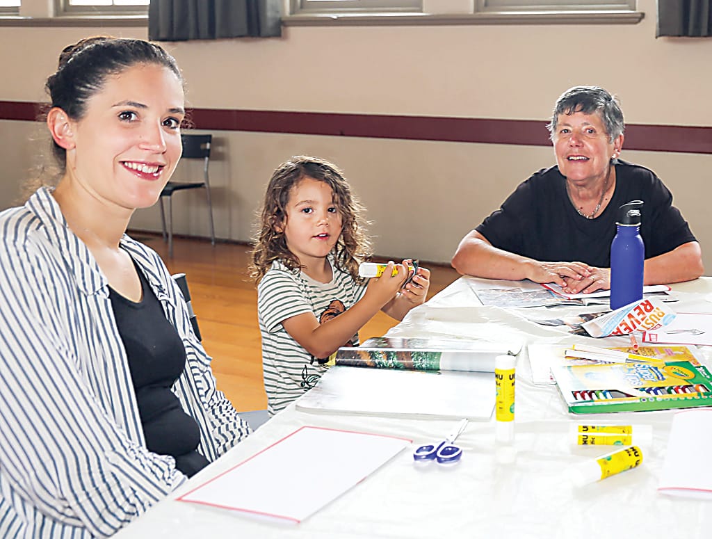 July Keen and Louis Keen, from Warragul, work on some art with Liz Rechsteiner.