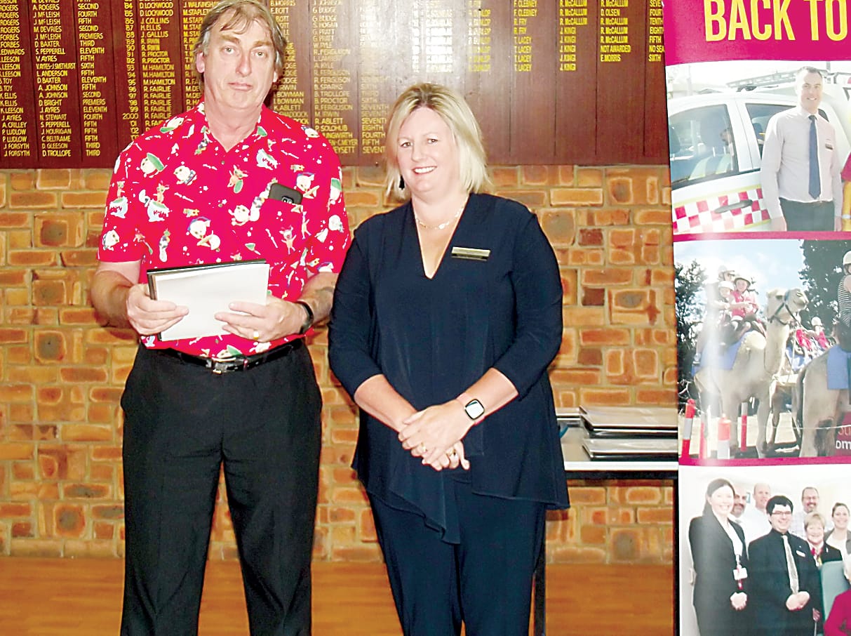 Rod McLean expresses appreciation to community bank director Sonia Lombardo on behalf of the Drouin Devils Basketball Club for funding assistance towards the cost of 100 uniforms.