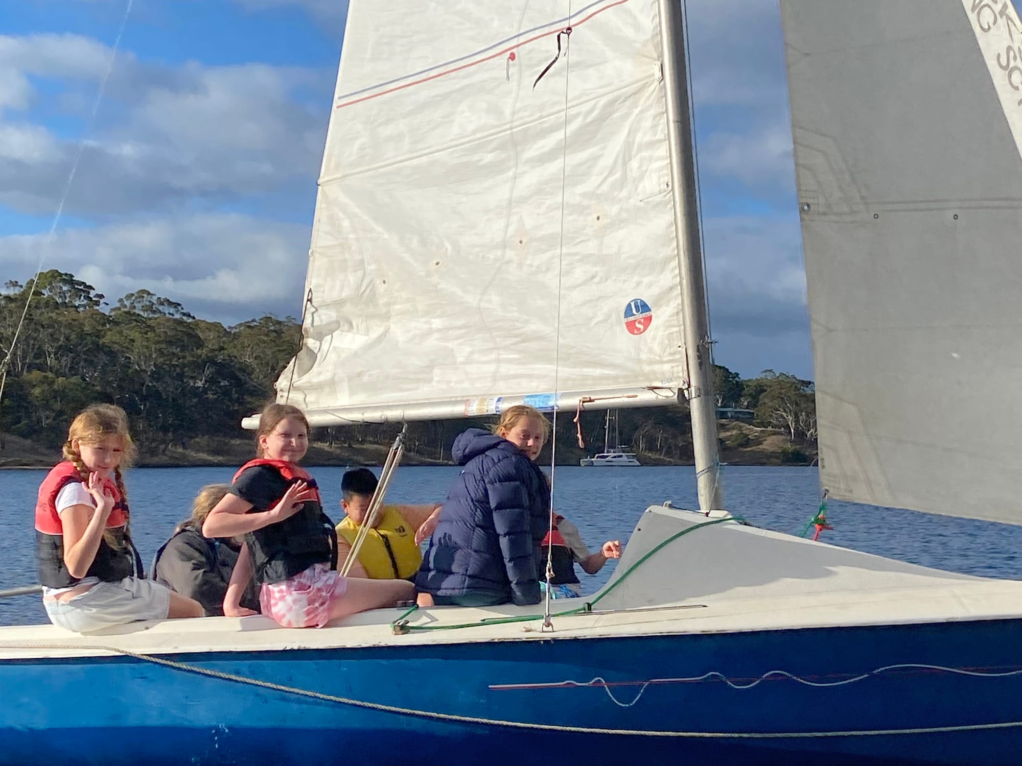 Learning the ropes in sailing are Alice Perry, Scarlett Lancaster, Anderson Qian and Emmy McDonald.