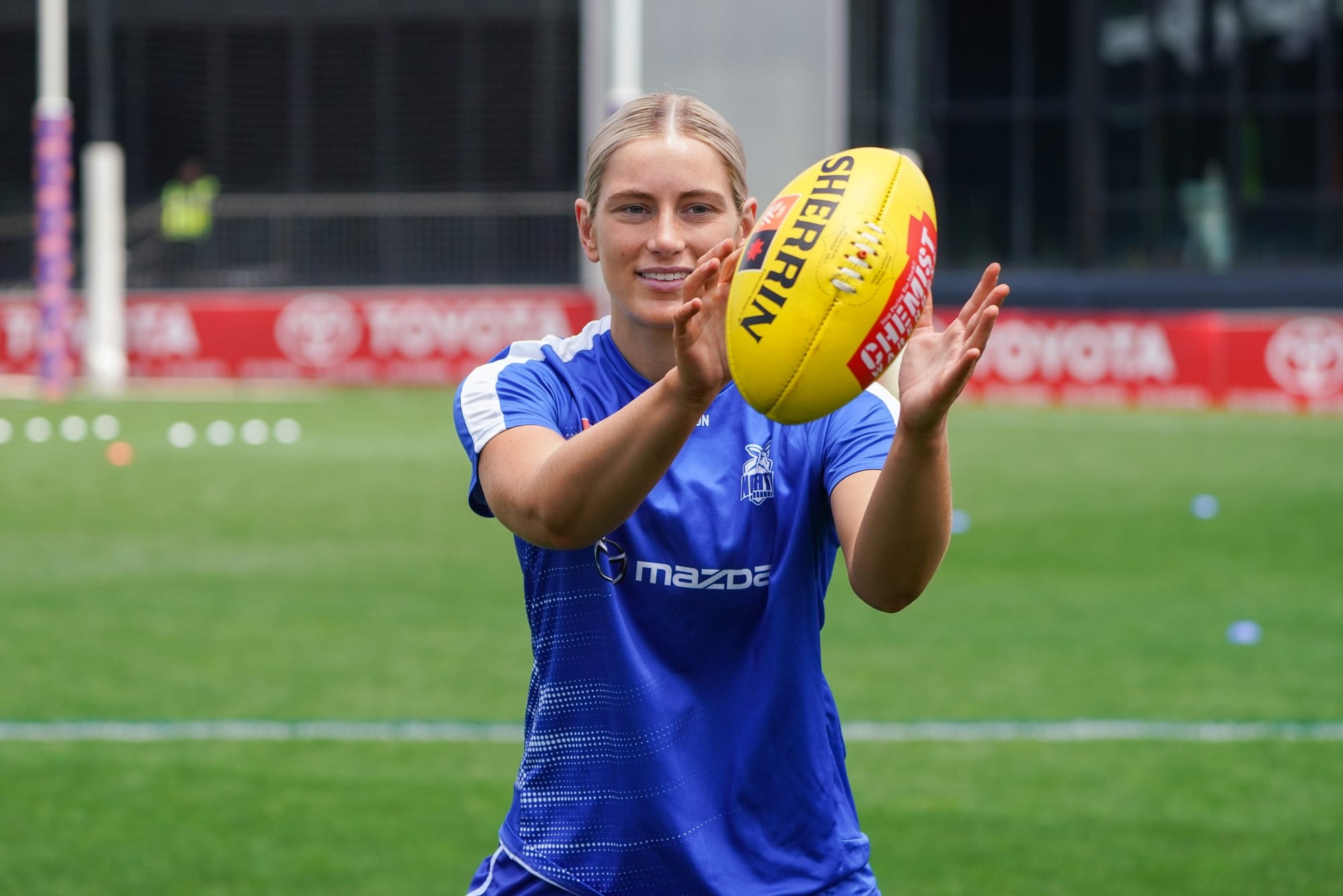North Melbourne player Jasmine Ferguson warms up before the AFLW grand final. Photograph courtesy of North Melbourne Football Club.
