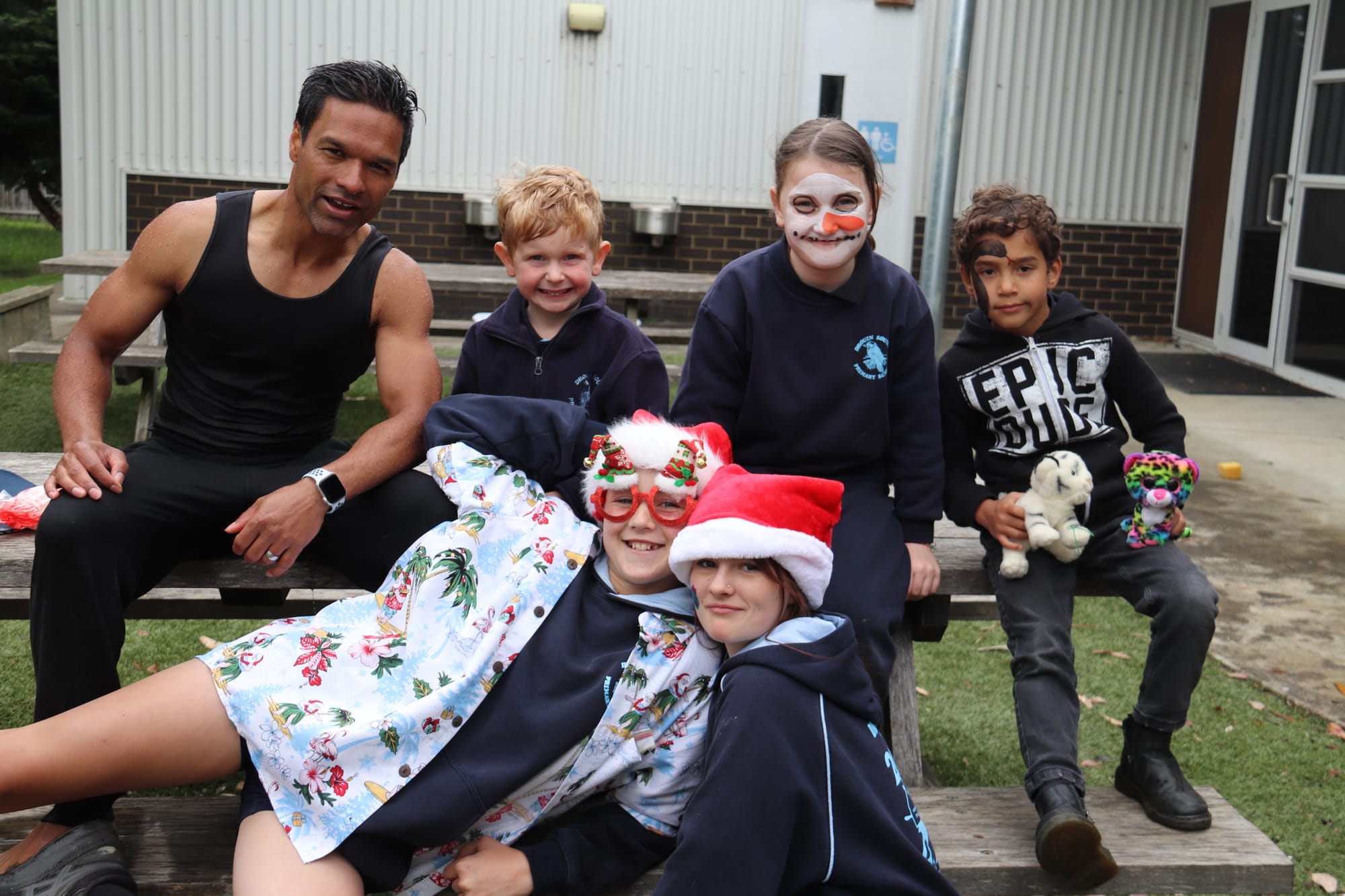 Students got to enjoy the outdoors during the carnival too. Back: staff member Josh, Lachy, Bella and Tyson. Front: Nicola and Eden.