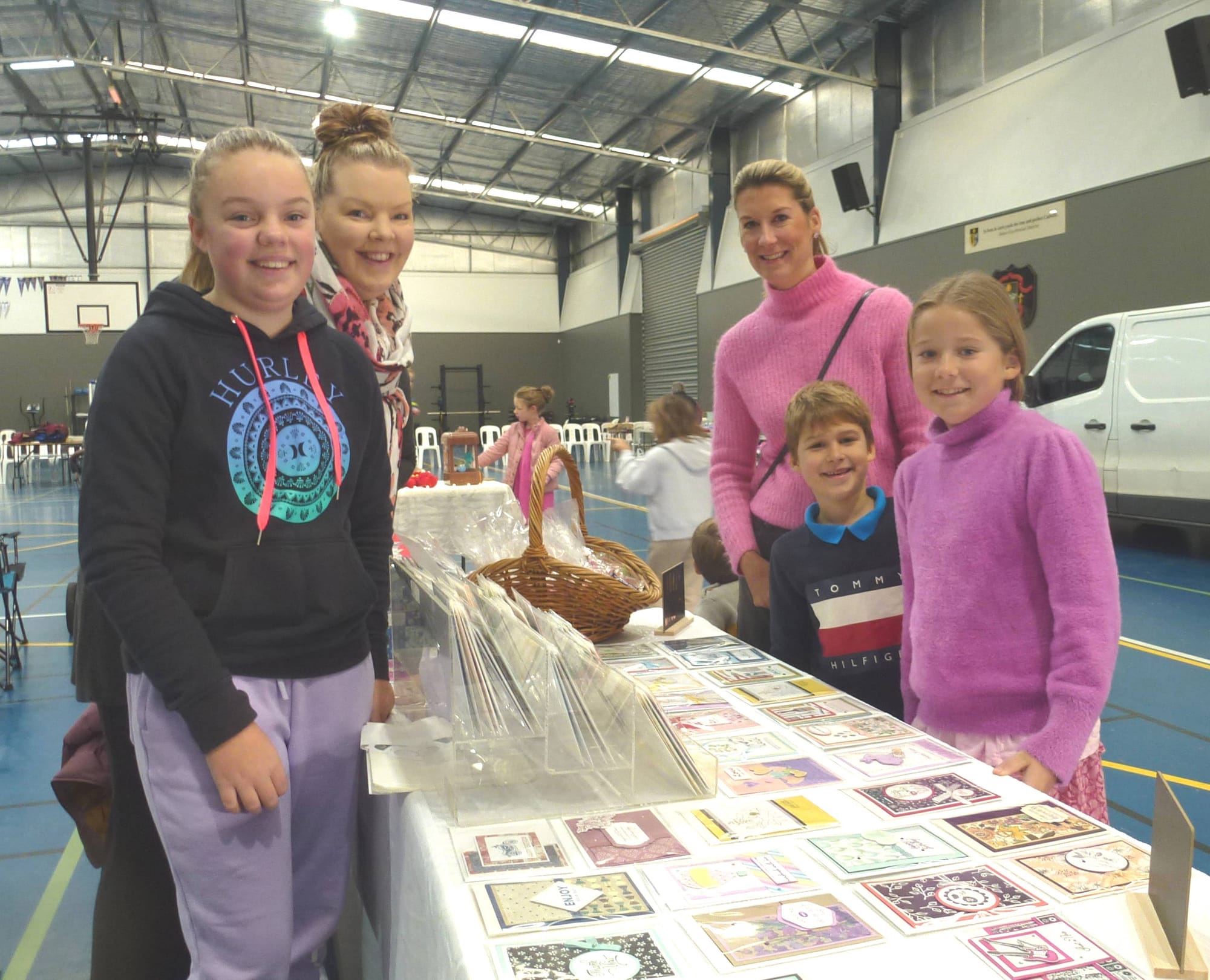 Checking out the variety of handmade greeting cards is Catherine Smit and children Raphael and Siena from Pakenham. Card maker Summer Gribble and her mum Brigid display their cards.  Photos by Roman Kulkewycz