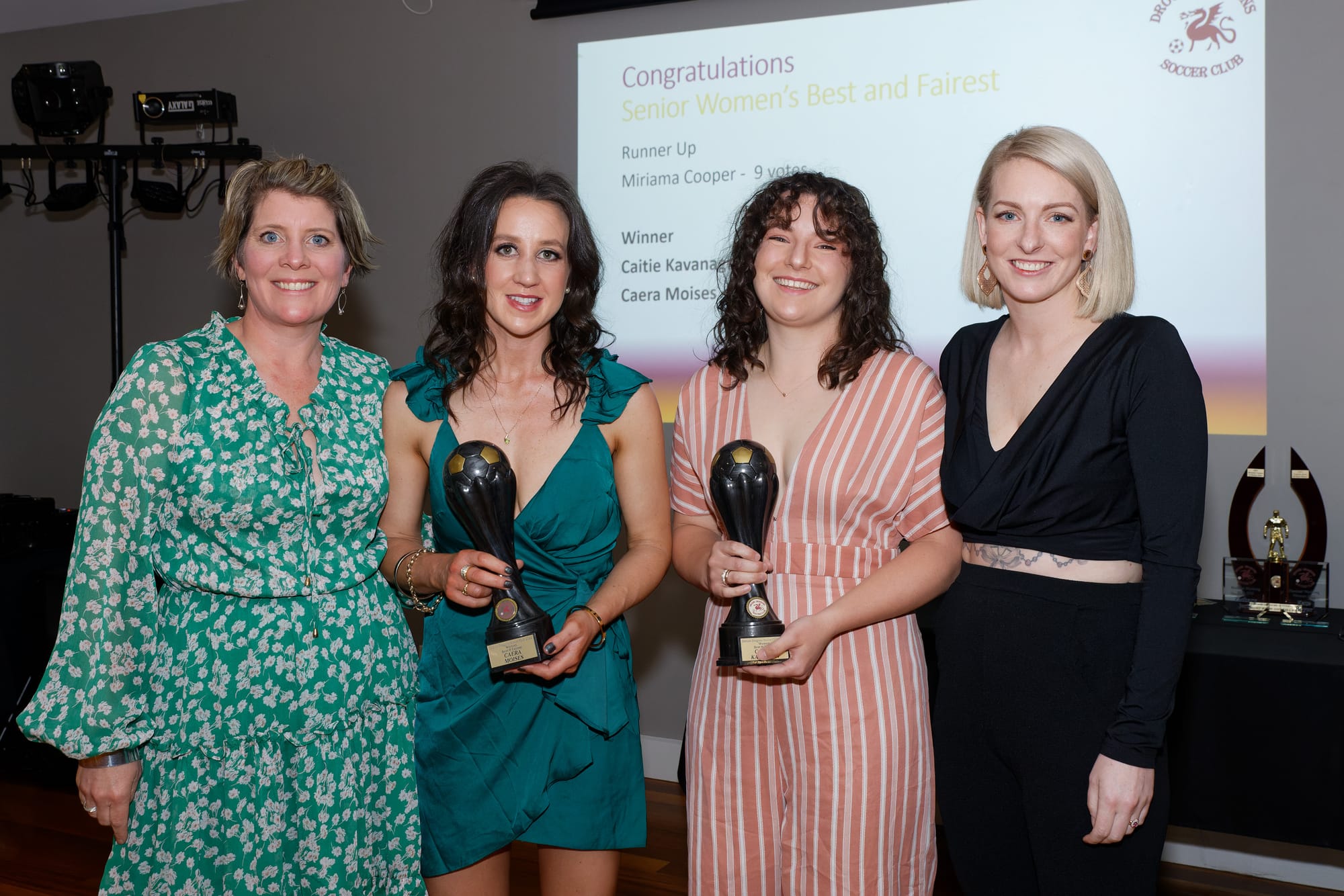 Senior women best and fairest winners Caera Moises and Caitie Kavanagh (centre) with coaches Kat Smythe (left) and Kate Boyer (right).