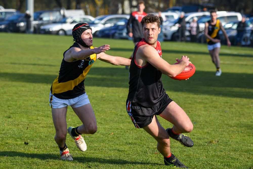 Footy seasons in limbo as COVID restrictions return post image