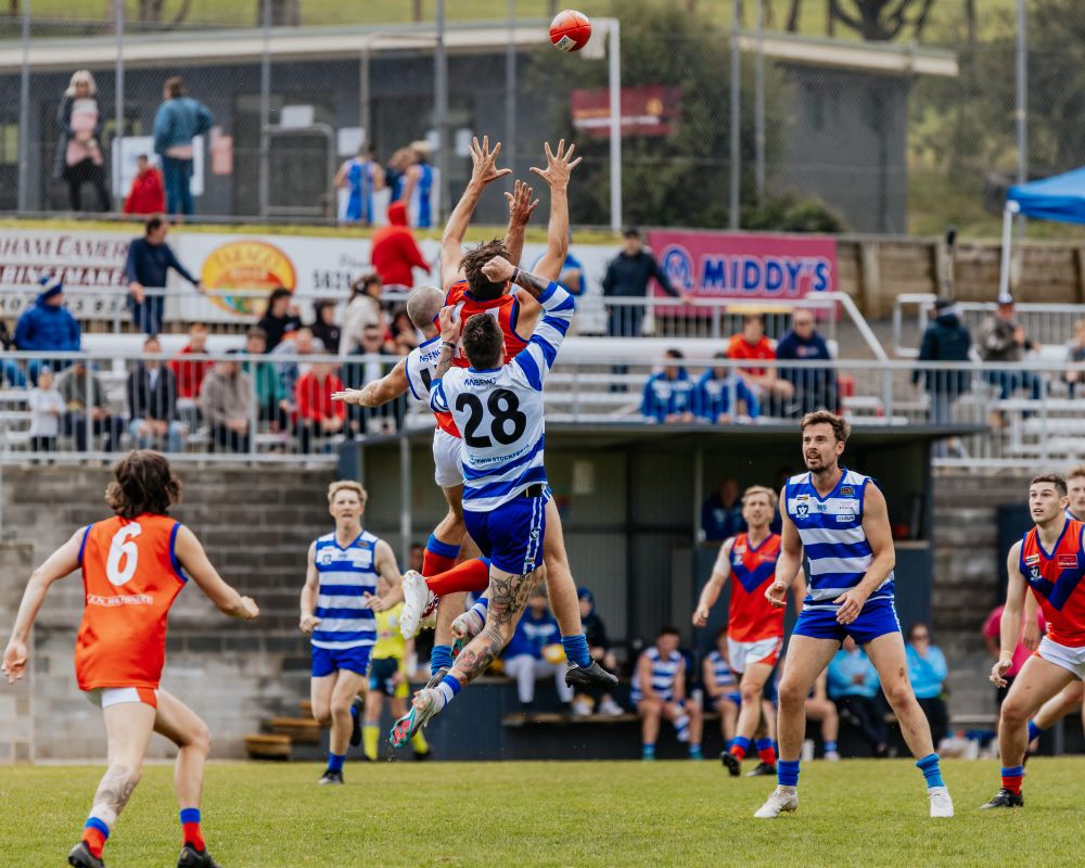 Rivals clash in front of AFL stars post image
