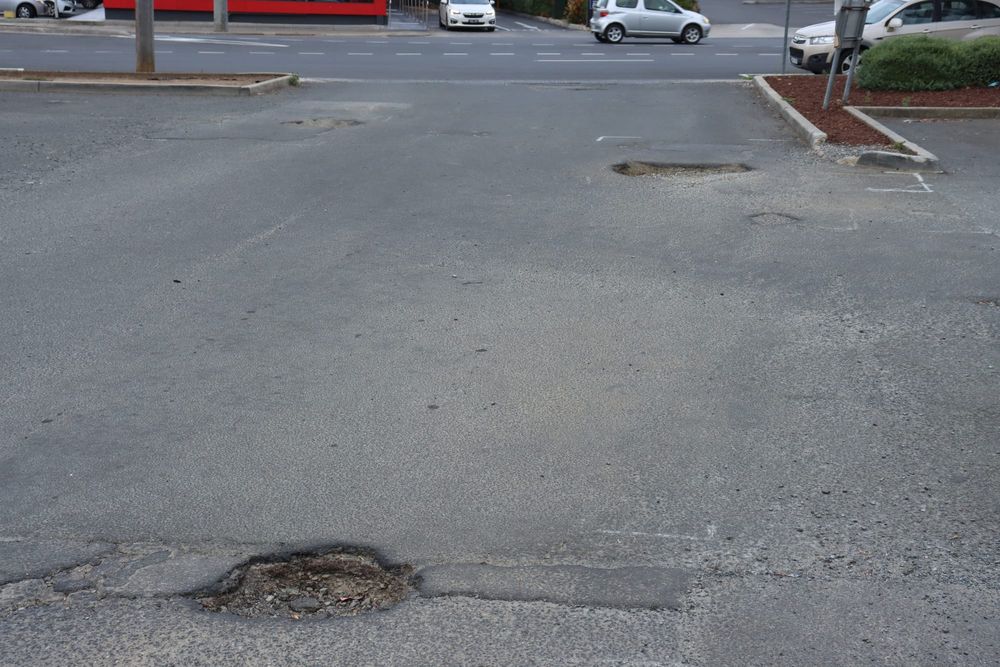 Leg injury after Woolworths carpark pothole fall post image