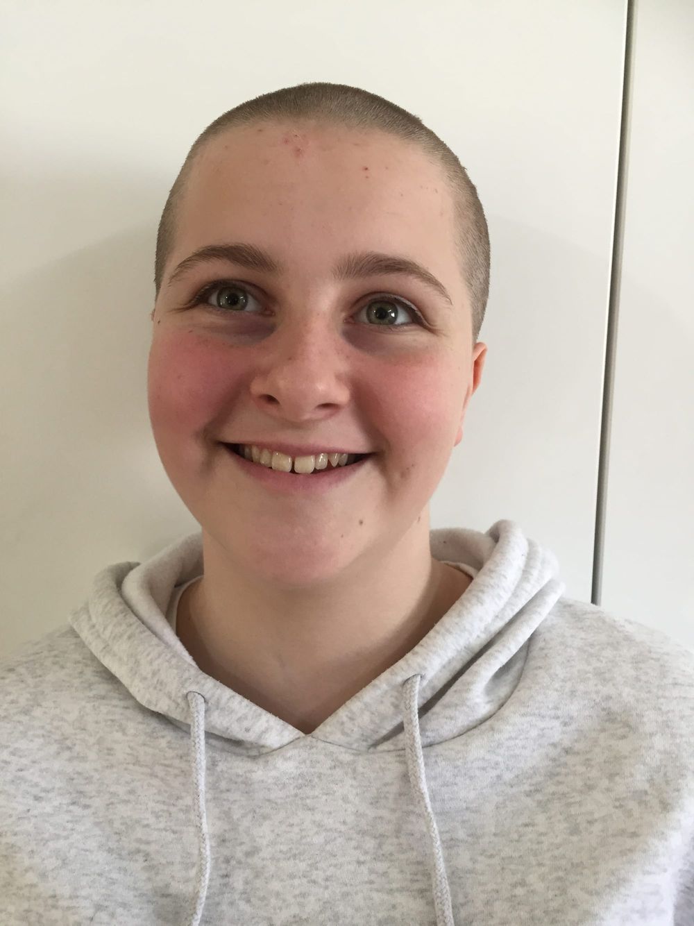 Claire shaves her head to raise funds for cancer research post image