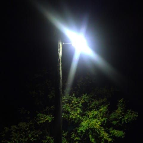 Backflip on public lighting post image