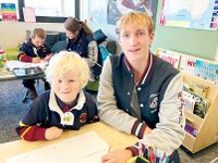 Senior and junior students connect post image