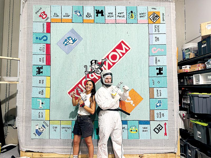 Giant Monopoly rug at home in library post image
