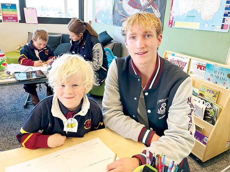 Senior and junior students connect post image