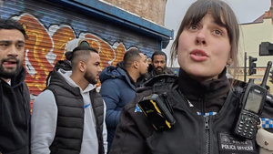 At last, a police officer defends a Christian preacher from a Muslim crowd