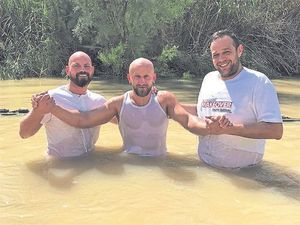 Three former addicts baptised in the Jordan