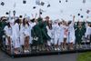 Mortarboards fly as showers subside