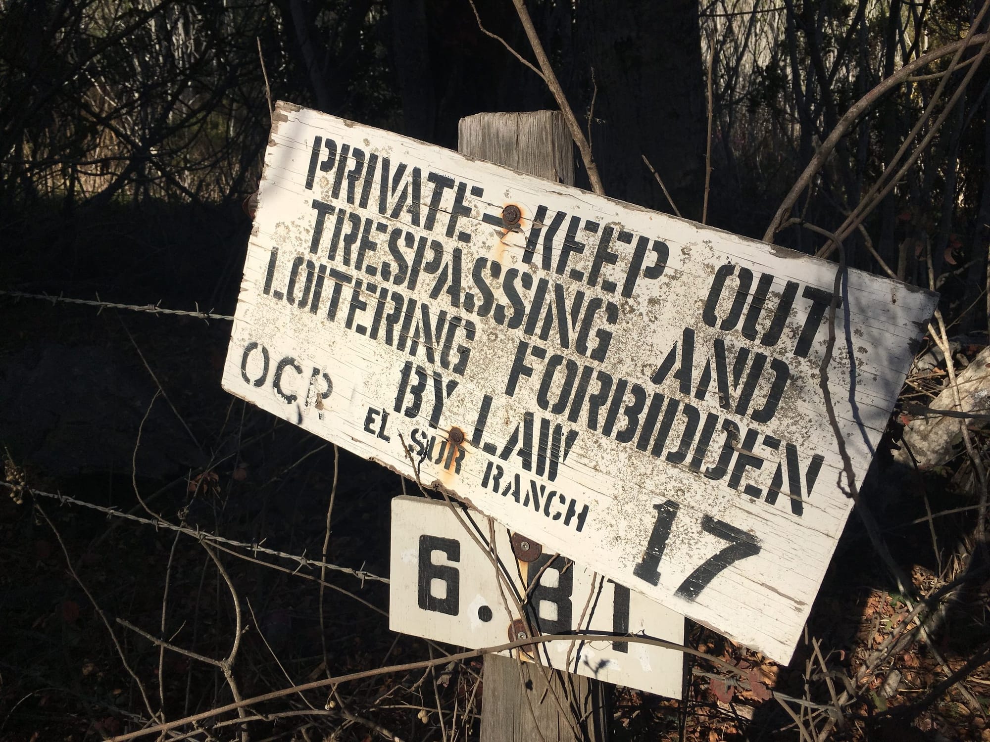 Hand-painted El Sur Ranch sign at mile marker 6.81