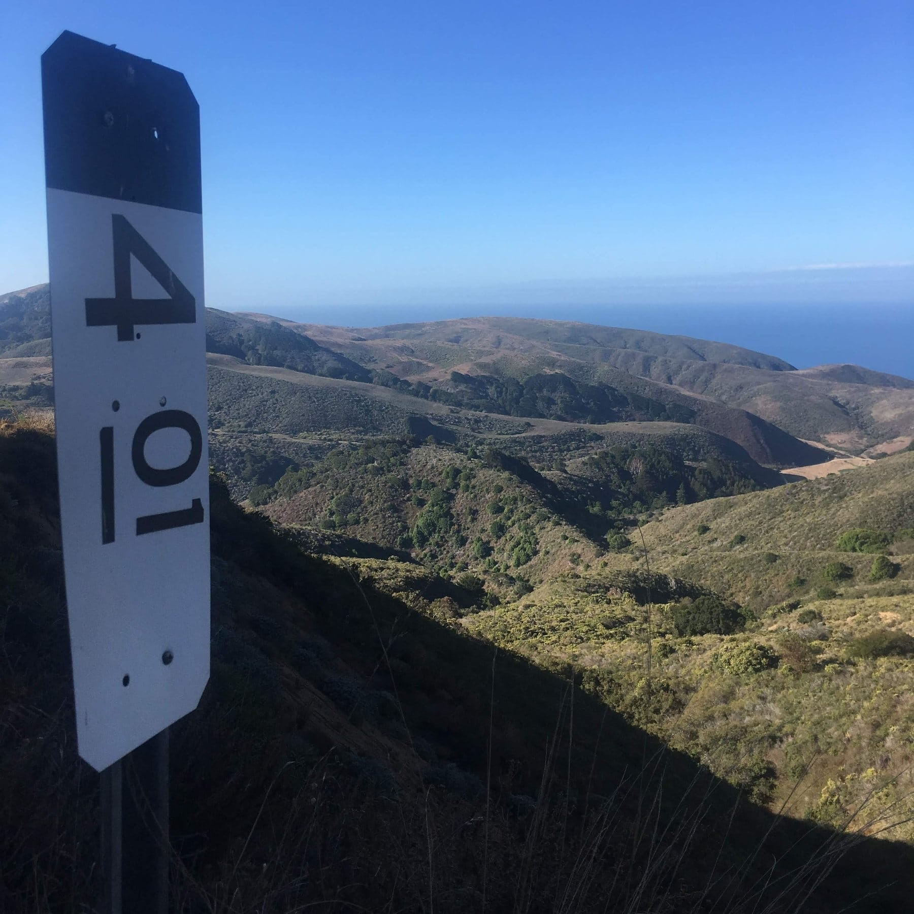 Mile marker 4.01 at the top of the first climb, the valley running down to the ocean