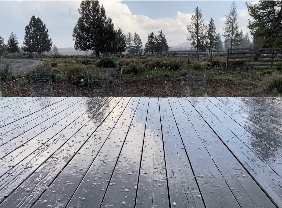 Hail falling on a wooden deck in Central Oregon