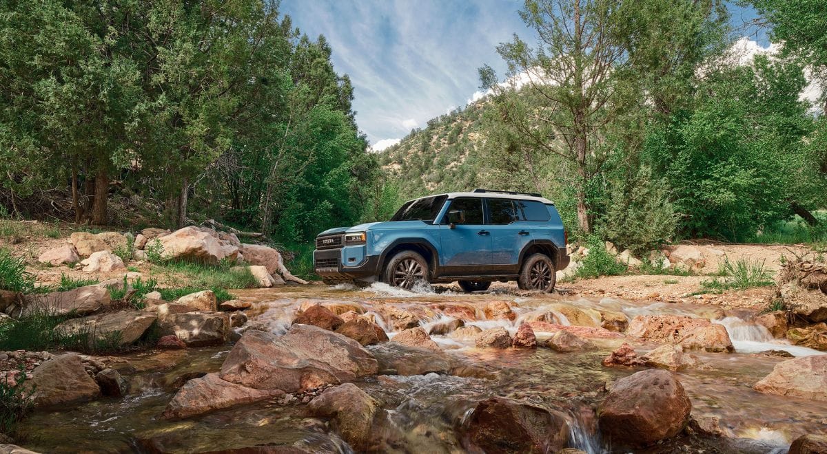 2025 Toyota Land Cruiser J250 driving on dirt trail