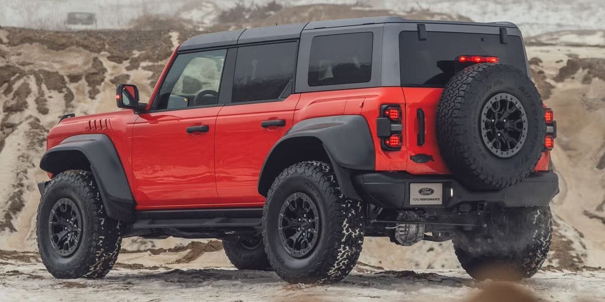 Ford Ranger Raptor in the desert rear quarter panel view.