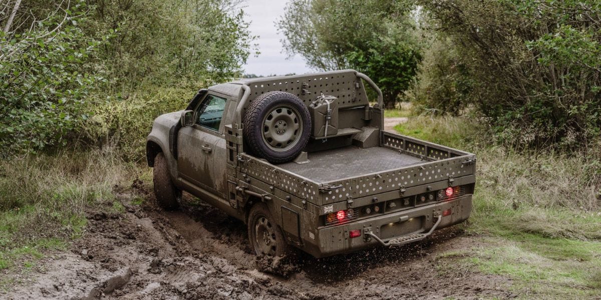 Land Rover Defender Military Pickup in Mud