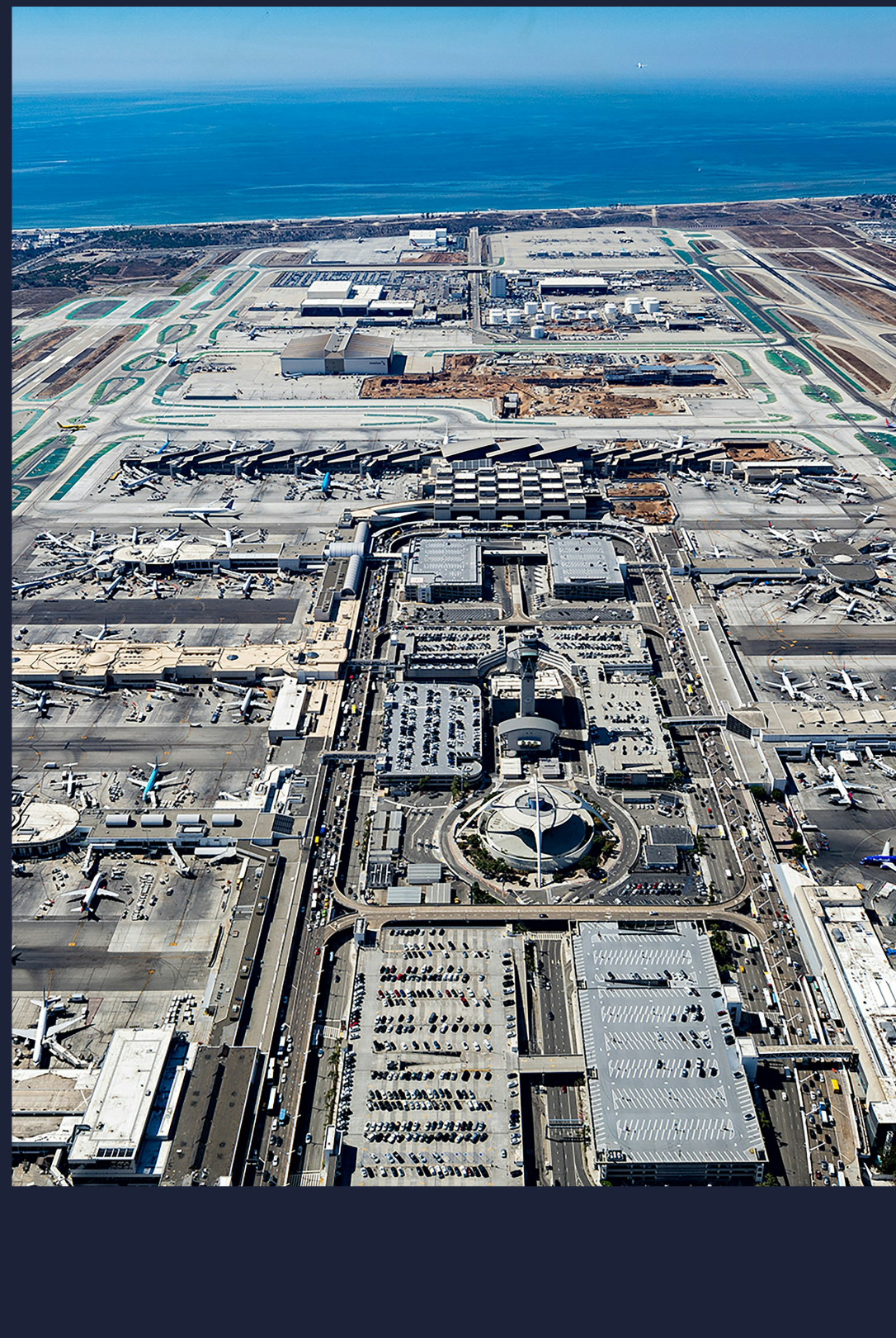 Aerial view of Los Angeles International Airport (LAX) with the Pacific Ocean in the background