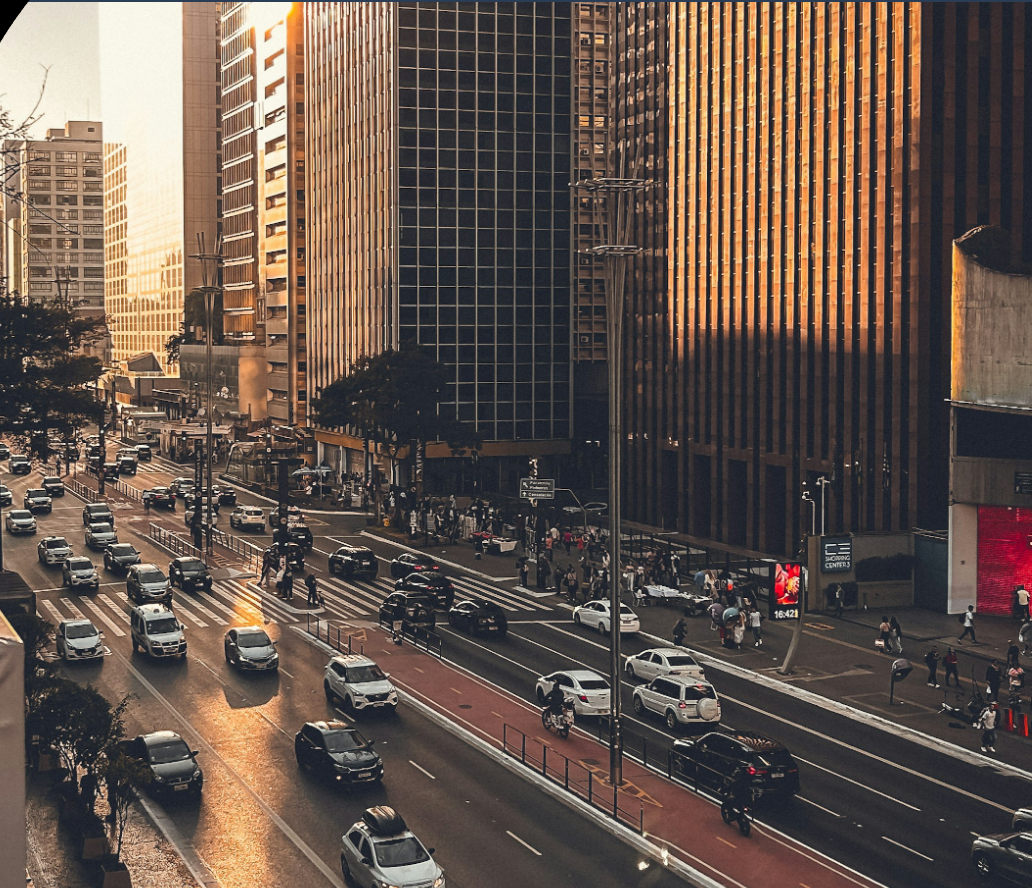 Avenida Paulista traffic among skyscrapers at golden hour, Sao Paulo, Brazil