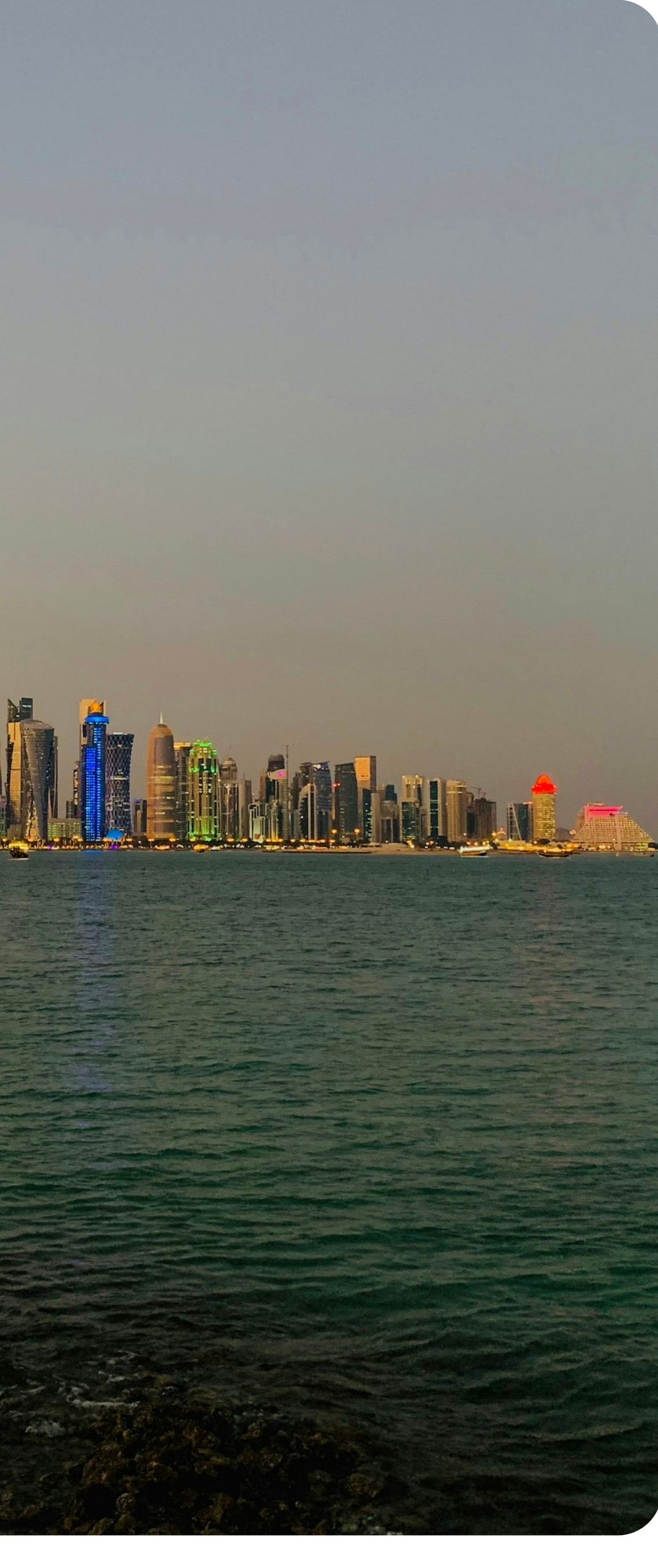 Doha Corniche skyline at dusk, Qatar