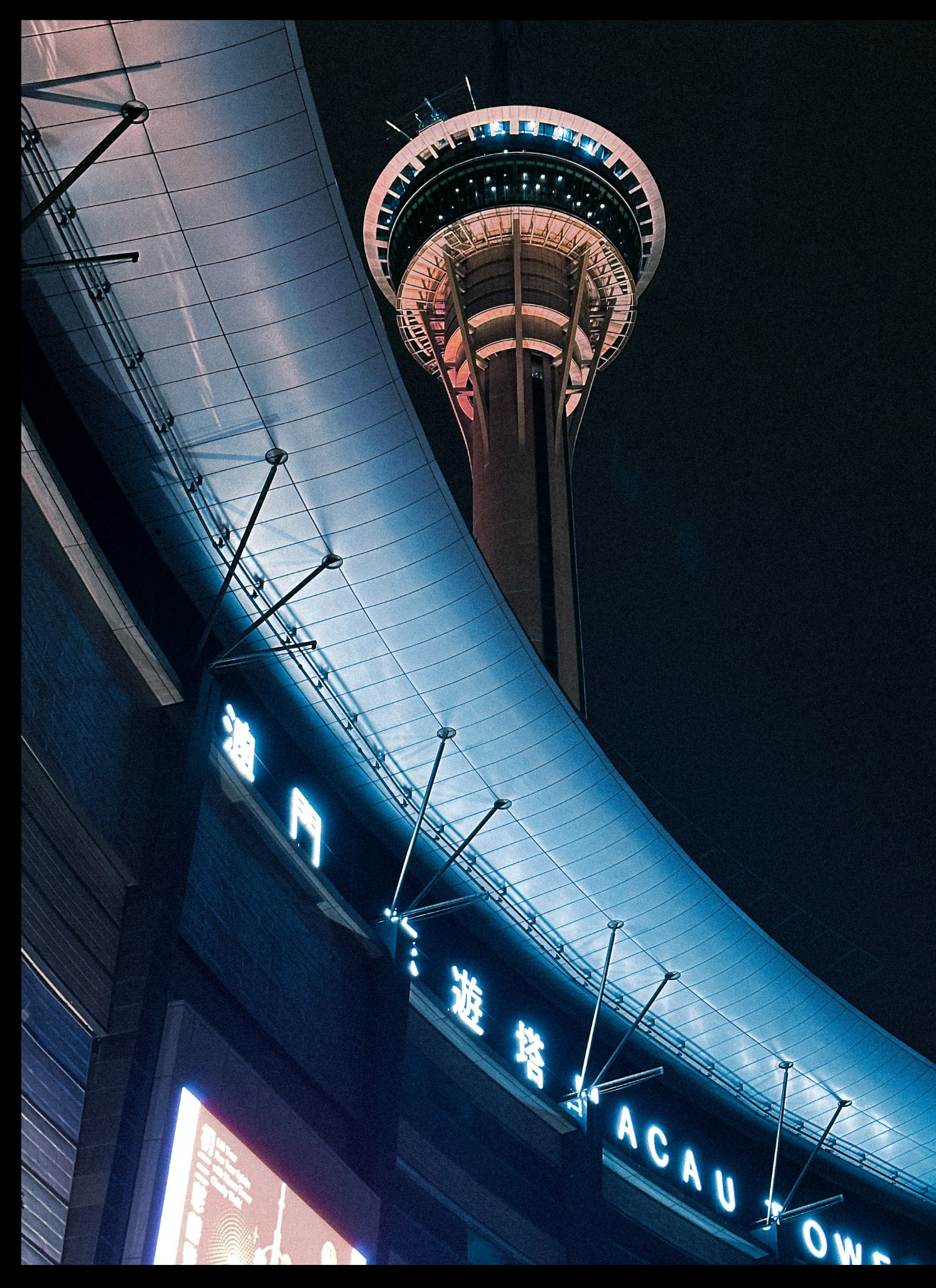 Macau Tower illuminated at night, Macau, China