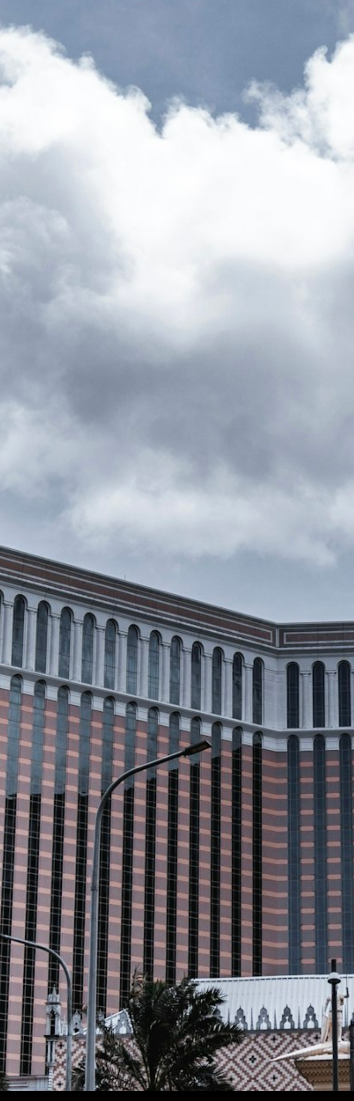 The Venetian Macao resort facade with palm tree, Cotai Strip, Macau