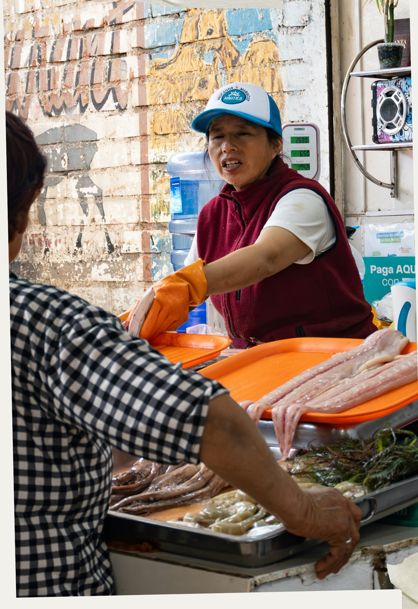 A seafood vendor at a fish market in Lima, Peru