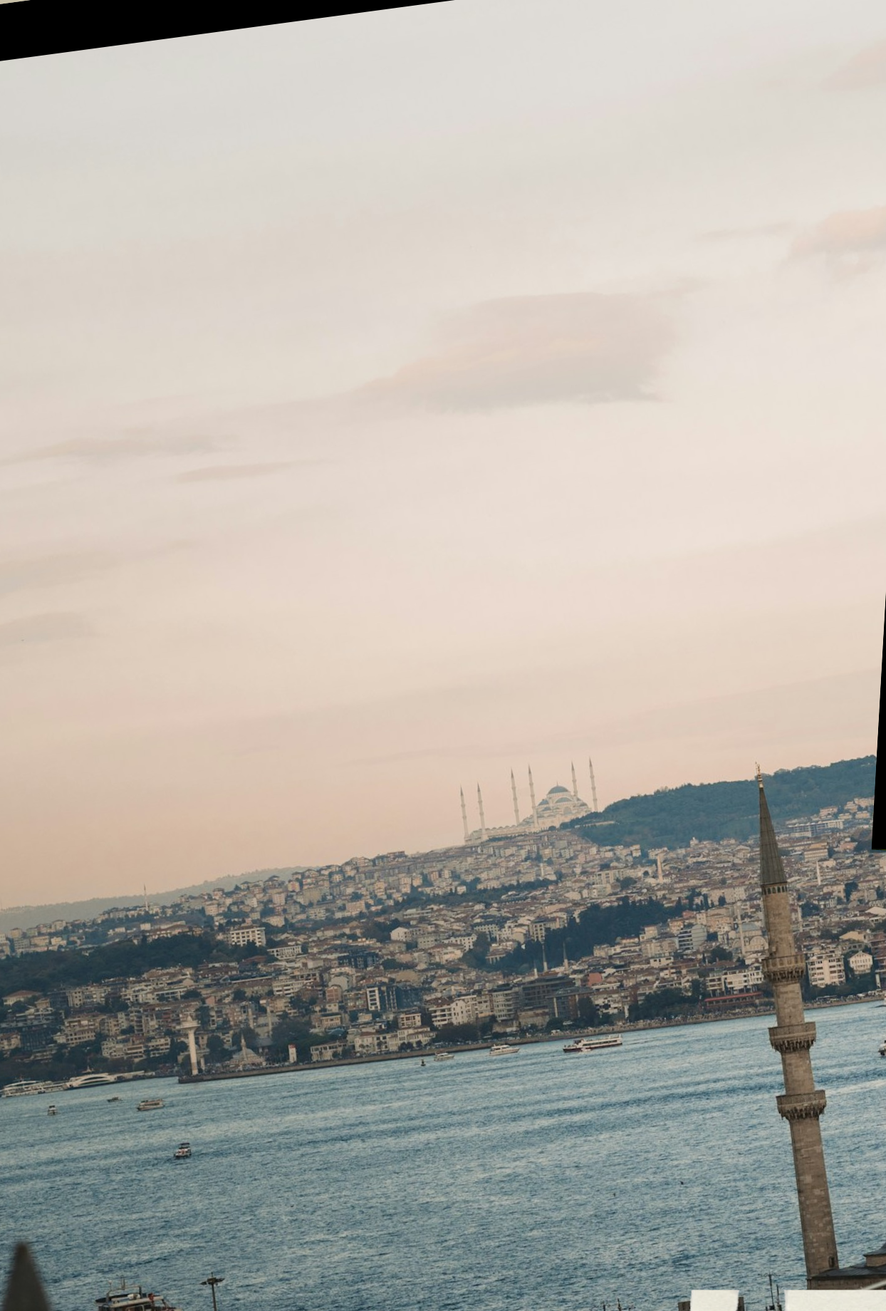 Bosphorus strait at dusk with mosque silhouette, Istanbul, Turkey