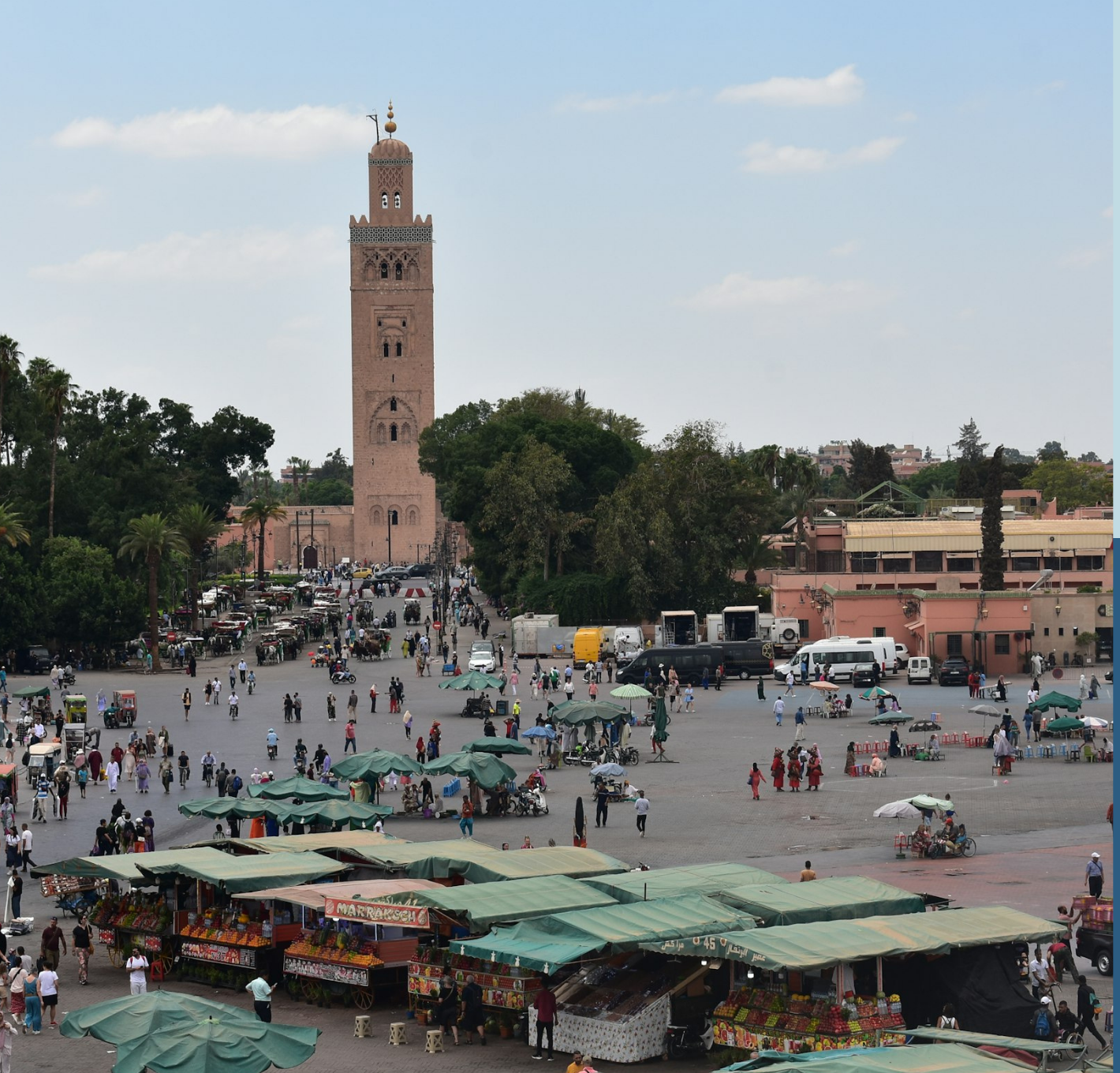 Jemaa el-Fnaa square with market stalls and the Koutoubia minaret, Marrakech, Morocco