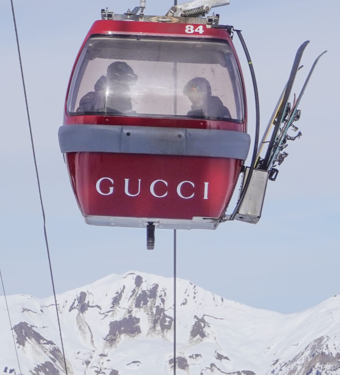Gucci branded gondola cabins and billboard in an Alpine resort