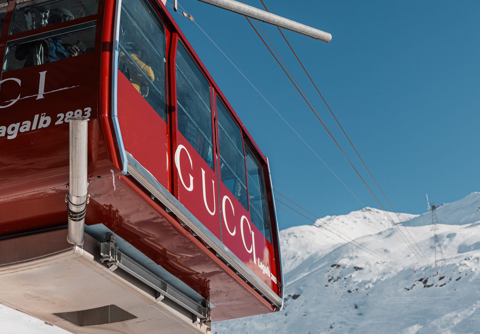 Gucci branded gondola cabins and billboard in an Alpine resort
