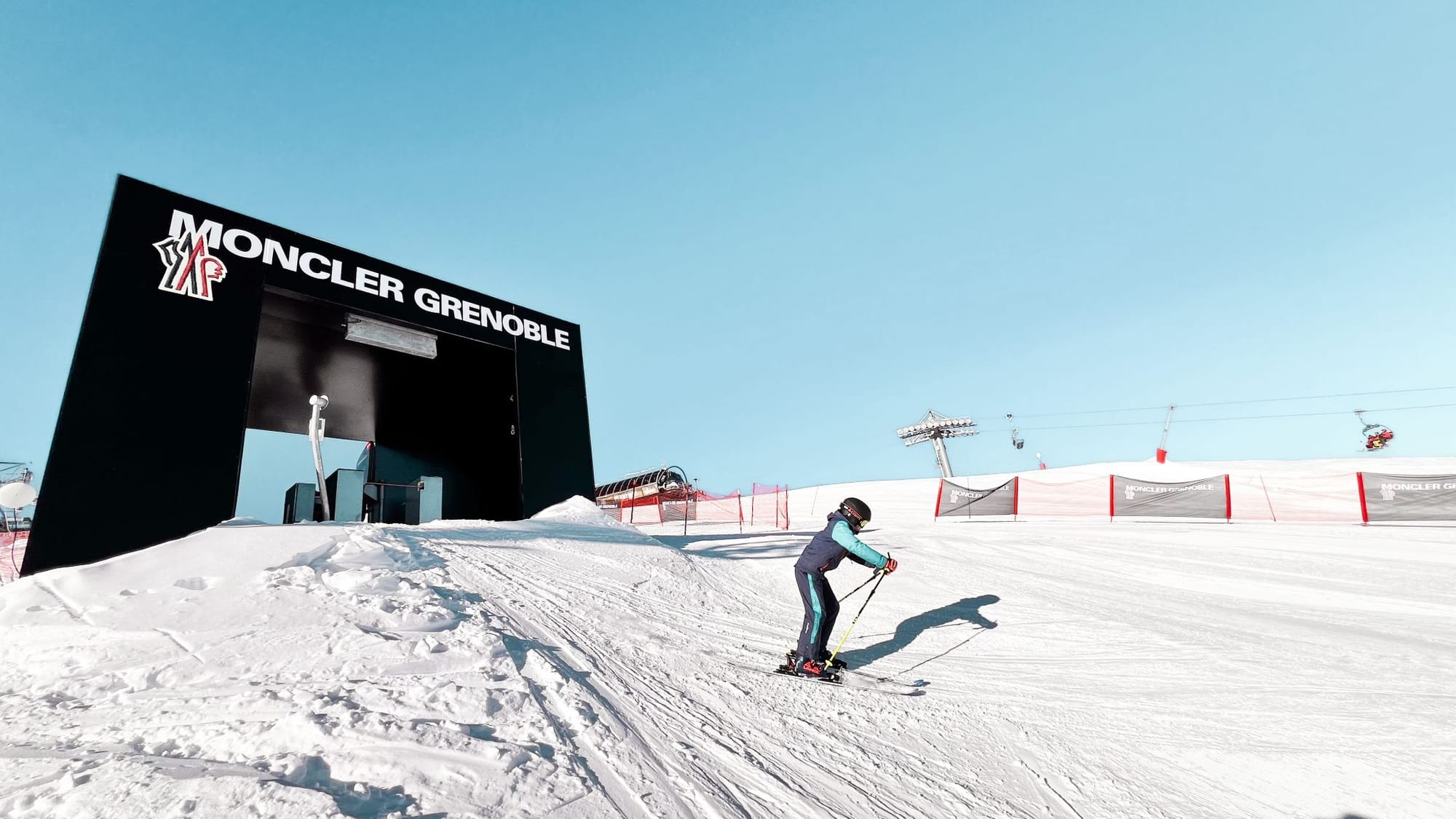 Moncler Grenoble branded gondola, billboard and ski-run installations in the Alps