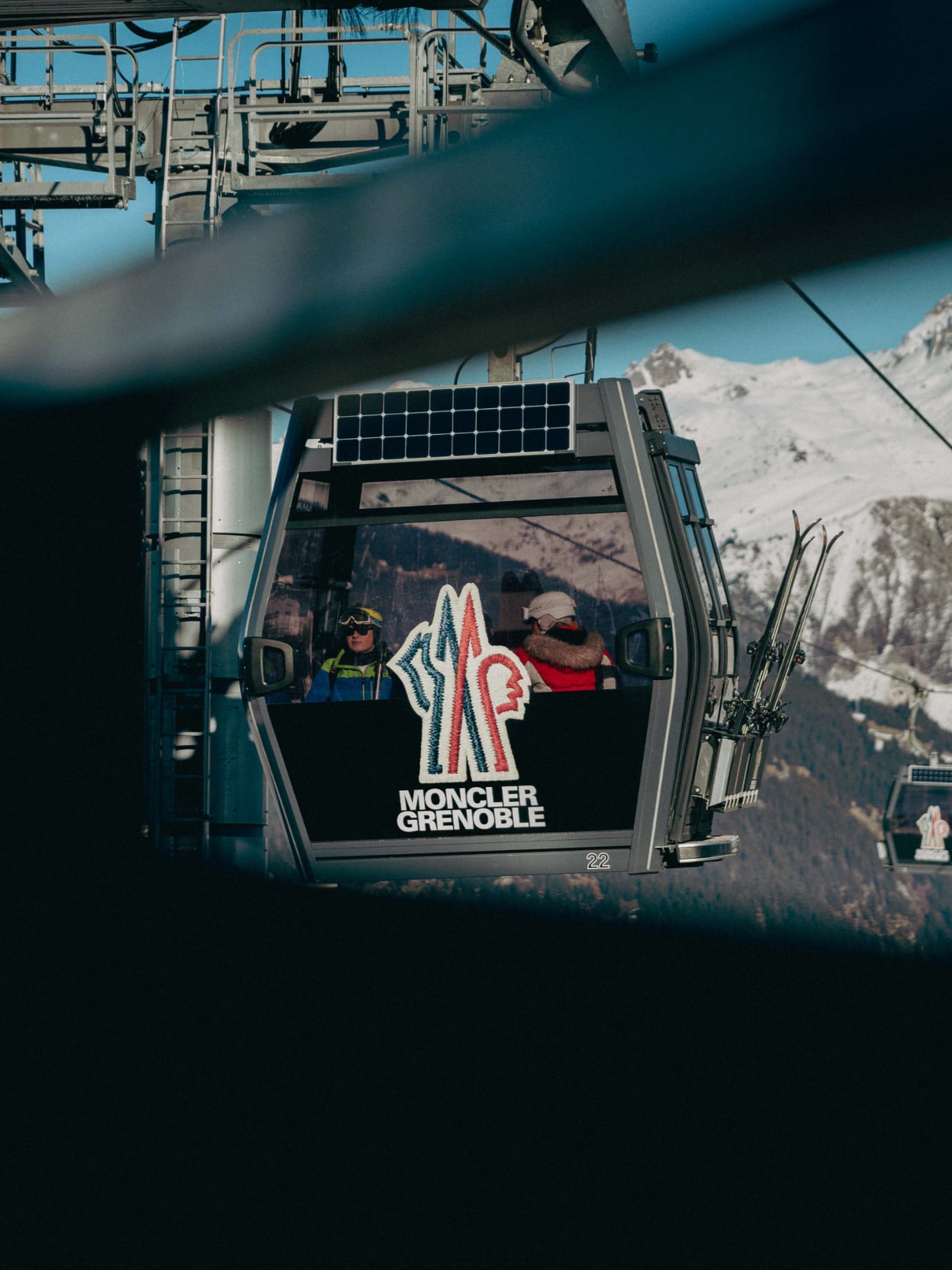 Moncler Grenoble branded gondola, billboard and ski-run installations in the Alps