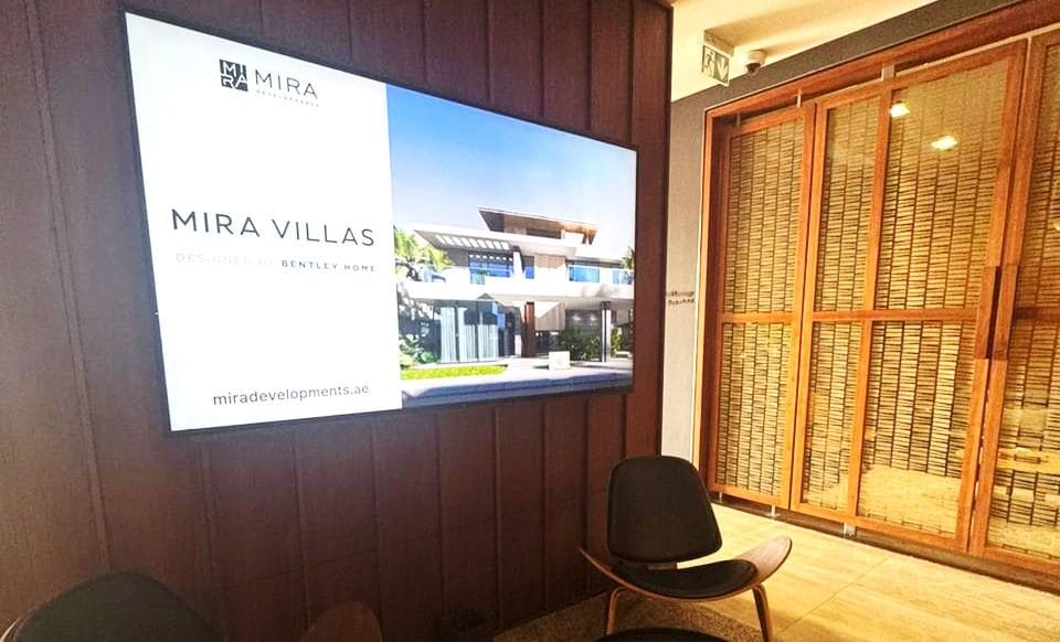 Digital screen in the Abu Dhabi private jet terminal lounge
