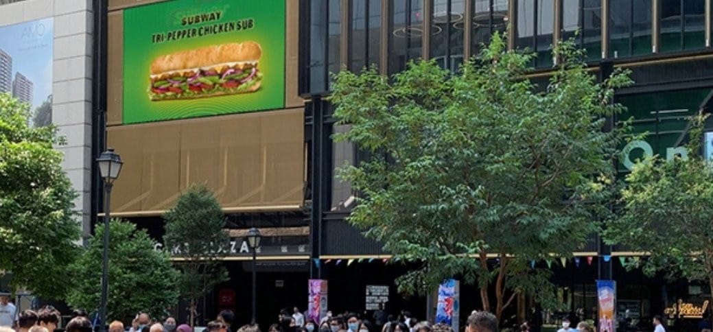 Large-format retail screen in a Singapore shopping area