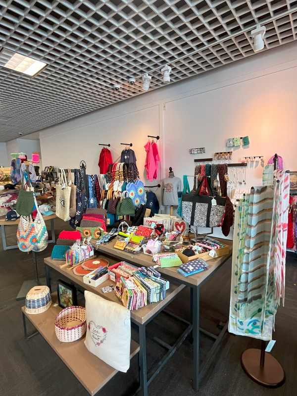Tables and hooks display local, handmade crafts.
