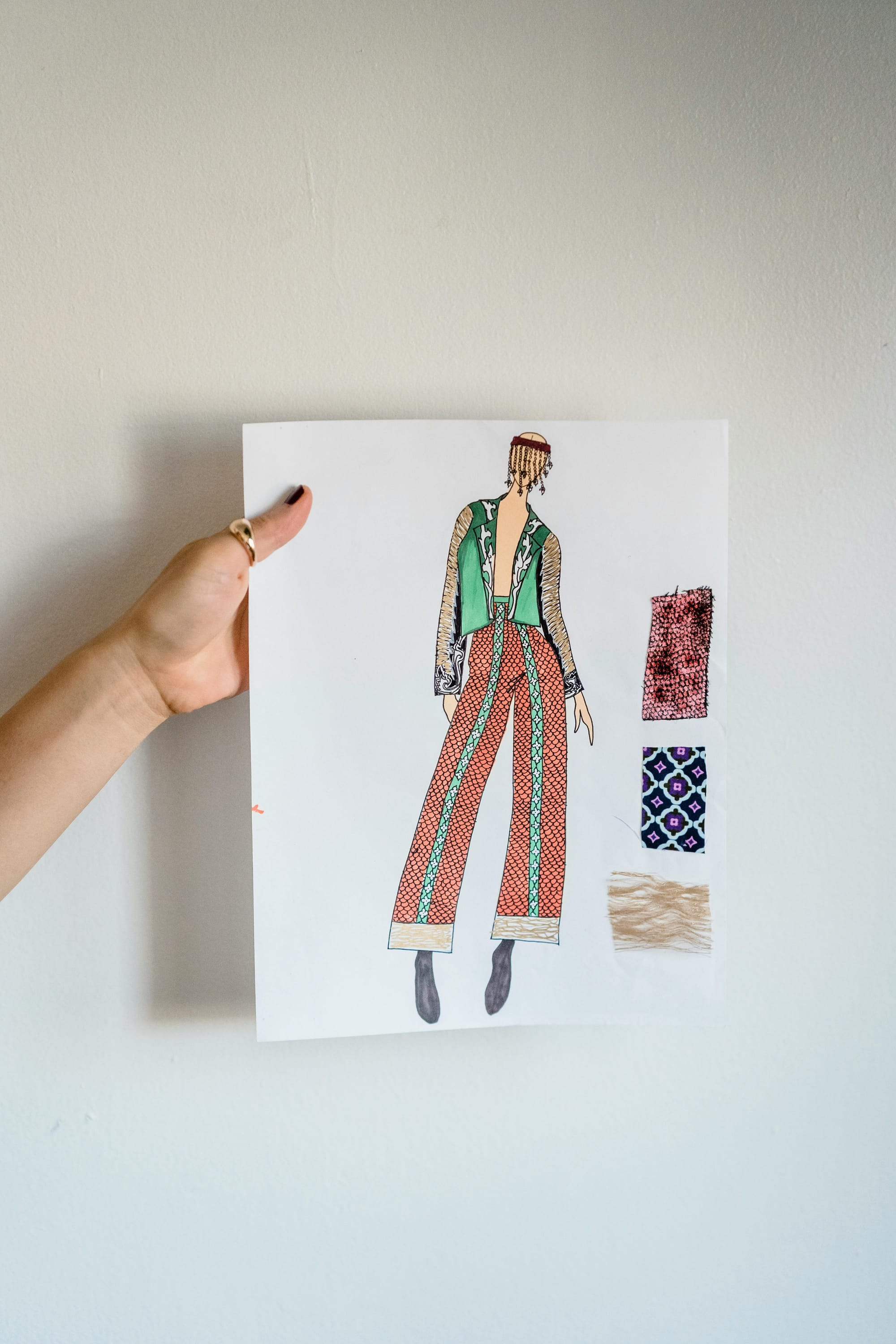 Unrecognizable woman demonstrating fashion sketching in white atelier
<p>" class="wp-image-8764"><figcaption class=