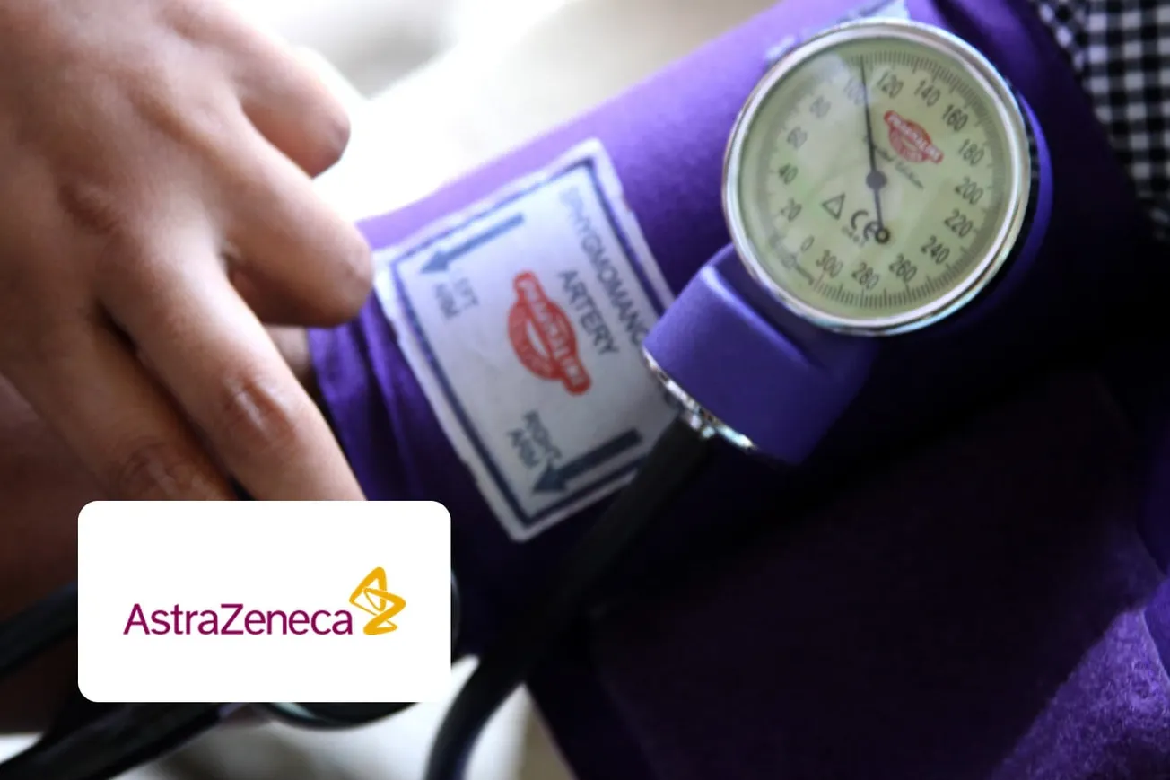 A blood pressure cuff and gauge on a patient's arm