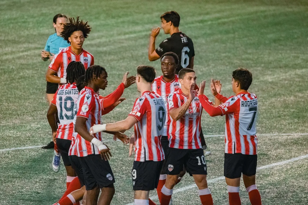 Zoomed N: Atlético Ottawa with Northern Tribune