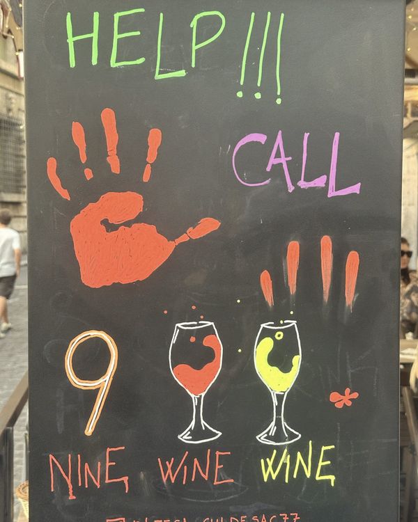 HELP!!! CALL 9 WINE WINE" chalkboard