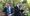 Business Men Using Digital Tablets Receiving Bad and God News While Sitting on Park Bench