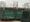 Picture of Old Trafford from the outside with the United Trinity statue in frame 