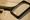 A magnifying glass placed over a book with text written in English 