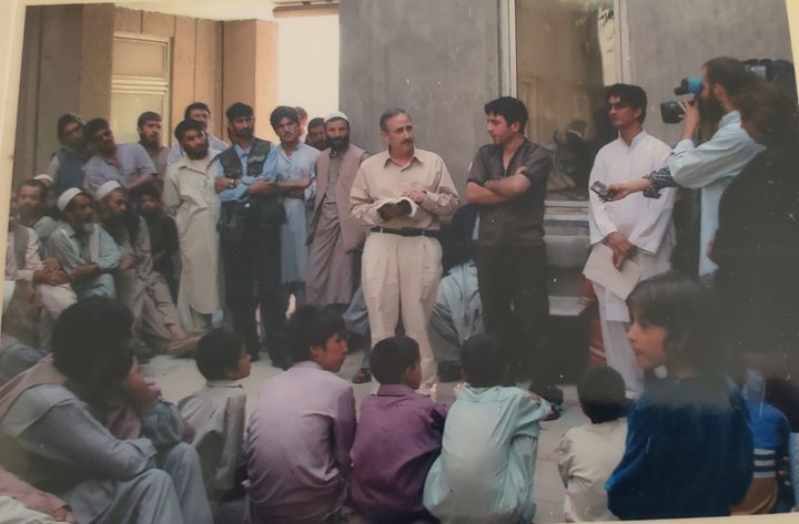 Craig Wiesner, reading a Jewish prayer to a gathering of Afghans who had lost loved ones during the coalition response to the September 11th attacks.