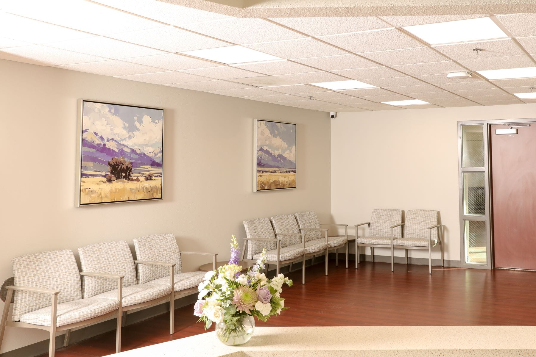 Rows of chairs and artwork in the waiting room at MountainView Urgent Care at Lohman.
